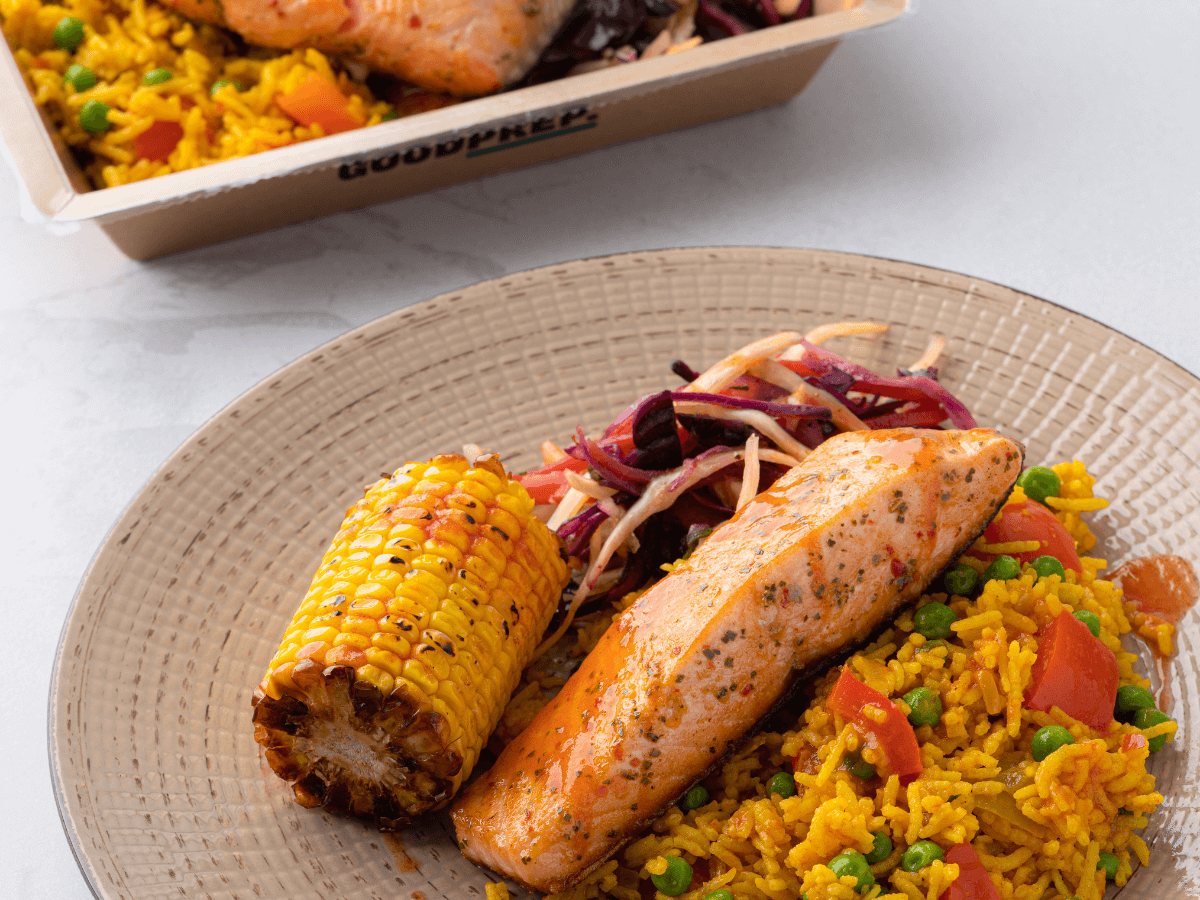 Image showing The Good Prep’s Piri Piri Salmon and Mexican Rice dish, with a side of sweetcorn.